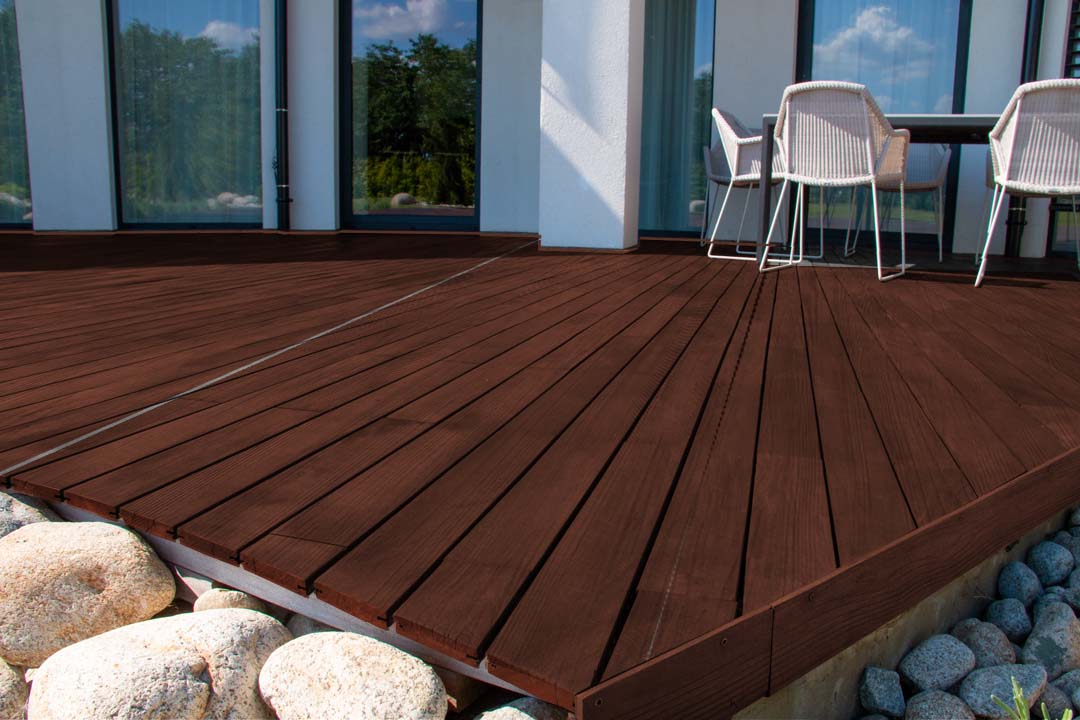 Retique It® Wood'n Finish Kit in Red Mahogany for exterior wood surfaces, shown on textured decking with a grained finish.