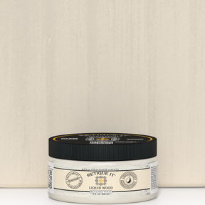 Retique It® Liquid Wood 8oz Bleached interior paint jar positioned in front of a color swatch, showcasing the product and color sample.