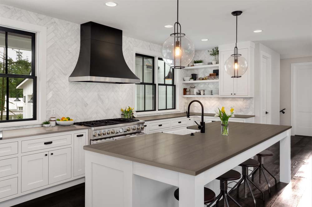 Retique It Multi-purpose Smooth Finish Kit (Med) in Harbor Gray for wood and furniture, shown on a kitchen countertop.