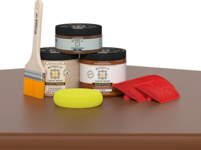 Retique It® Wood'n Finish Kit in Cedar for multi-purpose wood finishing, featuring small bottles of stain and topcoat on a table.