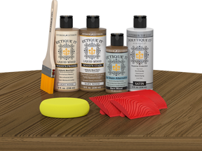 Retique It Wood'n Finish Kit in Barn Wood for exterior topcoat, shown on a table with wood sample and tools.