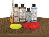 Retique It® Barn Wood Wood'n Kit with Light Wood primer, Barn Wood stain, Barn Wood gel stain alternative, Matte Tripletique® Top Coat, brush, red graining tool, and yellow sponge.