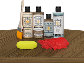 Retique It® Barn Wood Wood'n Kit with Light Wood primer, Barn Wood stain, Barn Wood gel stain alternative, Satin Tripletique® Top Coat, brush, red graining tool, and yellow sponge.