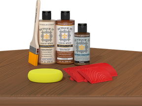 Retique It® Cedar wood stain kit for fireplace mantels, featuring wood finish application on a table surface.