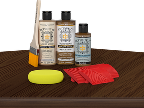 Multi-purpose Wood'n Kit in Dark Oak finish by Retique It® on a table, showcasing wood finishing tools and supplies.