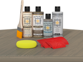 Retique It® Wood'n Finish Kit in Drift Wood with exterior top coat, displayed on a table for multi-purpose wood finishing.