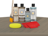 Retique It® Drift Wood Wood'n Kit with Light Wood primer, Drift Wood stain, Weathered Wood gel stain alternative, Matte Tripletique® Top Coat, brush, red graining tool, and yellow sponge.