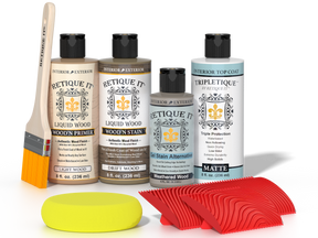 Retique It® Drift Wood Wood'n Kit with Light Wood primer, Drift Wood stain, Weathered Wood gel stain alternative, Matte Tripletique® Top Coat, brush, red graining tool, and yellow sponge.
