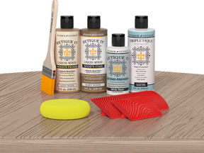 Retique It® Wood'n Finish Kit in French Oak stain displayed on a table, showcasing the wood stain product for furniture finishing.