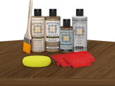 Retique It® Wood'n Kit Multi-purpose Modern Walnut exterior topcoat with a wood finish kit displayed on a table.