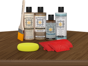 Retique It® Medium Walnut Wood'n Kit with Light Wood primer, Barn Wood stain, Pecan gel stain alternative, Gloss Tripletique® Top Coat, brush, red graining tool, and yellow sponge.