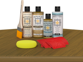 Retique It® Wood'n Finish Kit in Old Oak stain displayed on a table, showcasing natural wood color and finish for furniture projects.