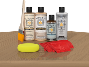 Multi-purpose Wood'n Kit Pickled Oak exterior top coat by Retique It®, showing the kit on a table with wood finish products.