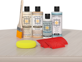Sun-bleached Retique It Wood'n Finish Kit for interior wood projects, featuring a multi-purpose top coat on a table surface.