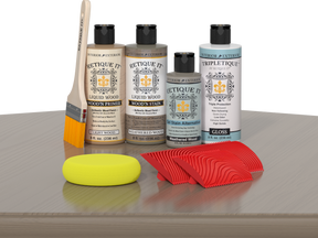 Weathered Wood Multi-purpose Wood'n Kit by Retique It® with interior top coat, displayed on a table showing wood finish application.