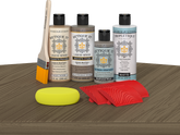 Retique It® Wood'n Finish Kit in Weathered Wood stain, showing a tabletop with weathered wood finish and stain application.