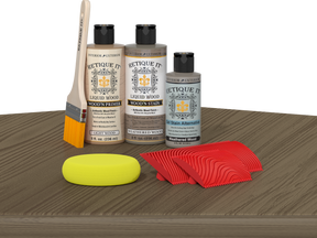 Weathered Wood Multi-purpose Wood'n Kit by Retique It® with finish and tools on a table for wood furniture restoration.