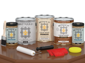 Retique It® Wood'n Finish Kit in cedar with gloss top coat, including four large exterior wood treatment bottles on a table.