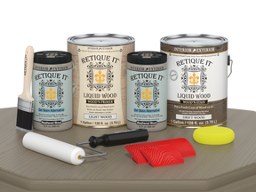 Retique It® Wood'n Kit with four large driftwood finish bottles, shown on a wooden table for multi-purpose wood finishing.