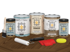 Retique It® Wood'n Finish Kit in Modern Walnut with matte topcoat, showing four large wood finishing bottles on a table.