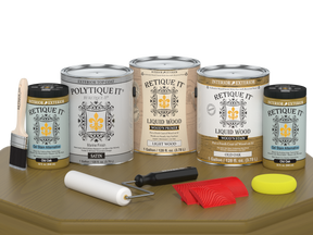 Retique It® Wood'n Finish Kit in Old Oak, exterior top coat, showing four large wood treatment bottles with satin finish on a table.