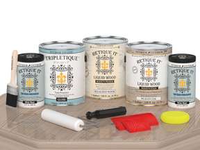 Sun-bleached Retique It® Wood'n Finish Kit for interior top coats, shown with gloss finish on a table.