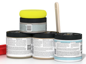 Back view of Retique It® Wood'n Finish Kit in Drift Wood for interior top coating, showing application tools and product packaging.