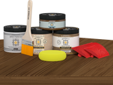 Retique It® Wood'n Finish Kit in Modern Walnut for exterior projects, with wood topcoat and application palette on a table.
