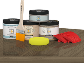 Retique It® Wood'n Finish Kit Double Size in Weathered Wood stain, featuring wood stain bottles and applicator tools on a table.