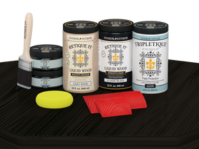 Retique It Wood'n Finish Kit with four large black stain bottles and satin finish on a table surface.