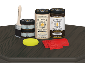Retique It® Wood'n Cabinet Kit with 12 charcoal-grained door stains displayed on a table, showcasing natural wood finish.