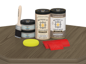 Retique It® Wood'n Finish front door kit in weathered wood stain, double door with detailed wood grain and hardware on a table.