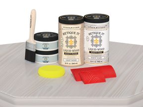 Retique It® Wood'n Cabinet Kit with 12 white wash grained door stains, displayed on a table showing wood grain detail.