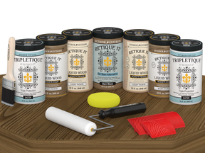 Retique It Wood'n Cabinet Kit with 24 barn wood-appearing stained cabinet doors in satin finish on a table.