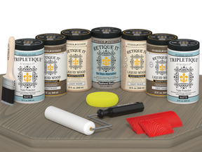 Retique It® Wood'n Cabinet Kit in Drift Wood stain with 24 grained cabinet doors on a table surface.