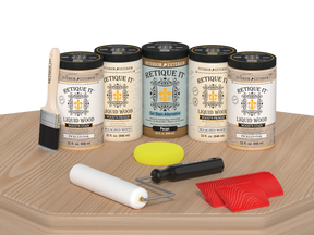 Retique It White Oak Kit with Liquid Wood, Pecan Gel Stain Alternative, yellow sponge, red graining tool, roller, and brush.