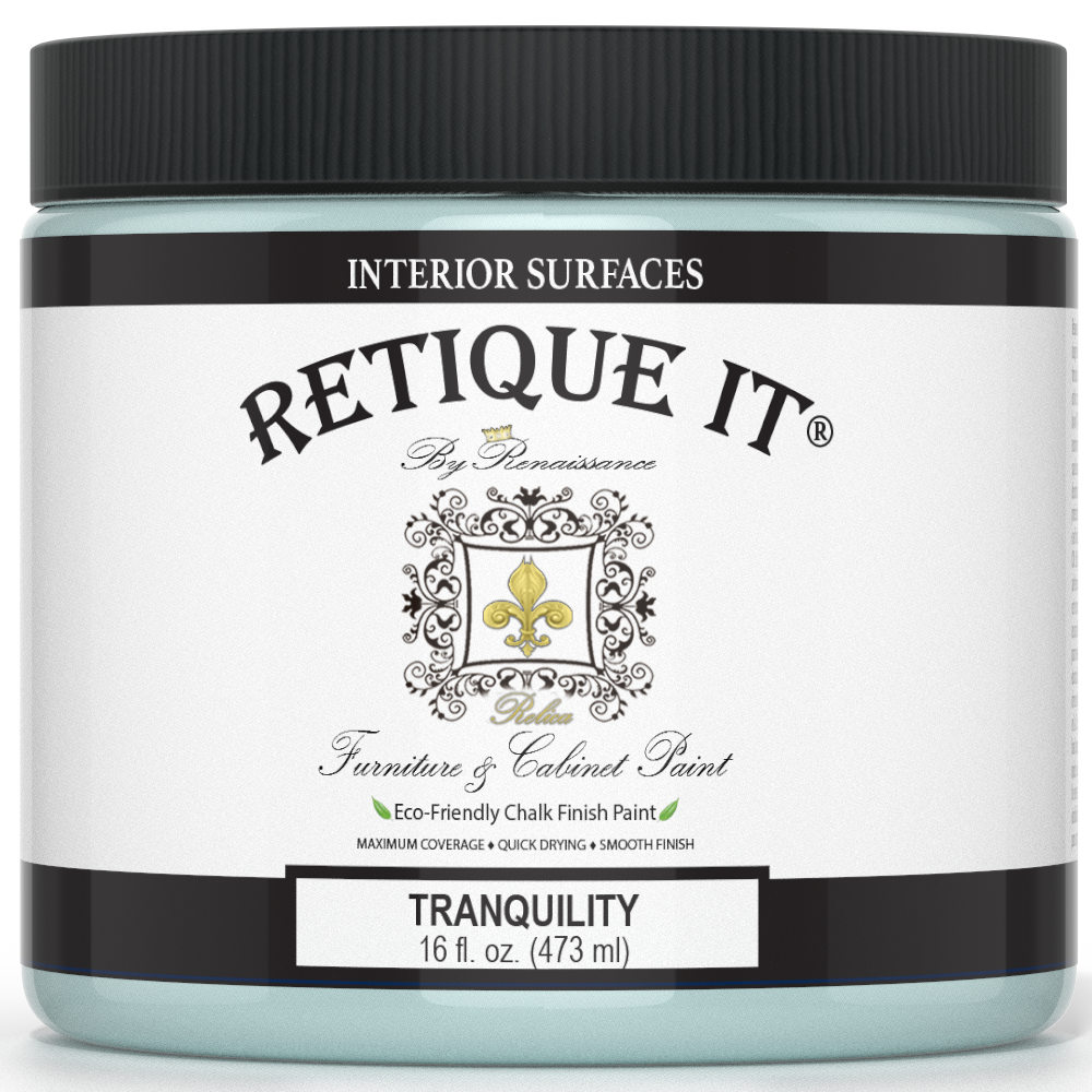 Retique It® Furniture & Cabinet Paint in Tranquility quart, showing the smooth, light blue finish on a cabinet surface.