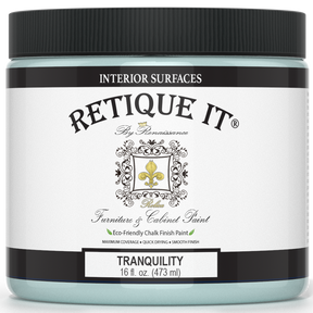 Retique It® Furniture & Cabinet Paint in Tranquility quart, showing the smooth, light blue finish on a cabinet surface.