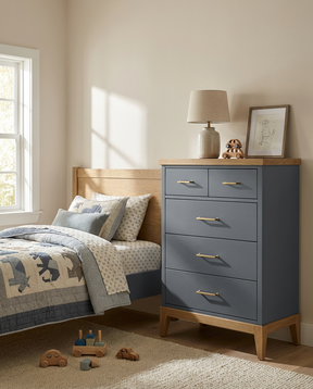 Children's bedroom with a blue dresser, bed, and toys.